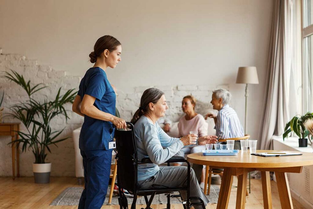 Older adult and family member reviewing a care plan together in a bright assisted living apartment.